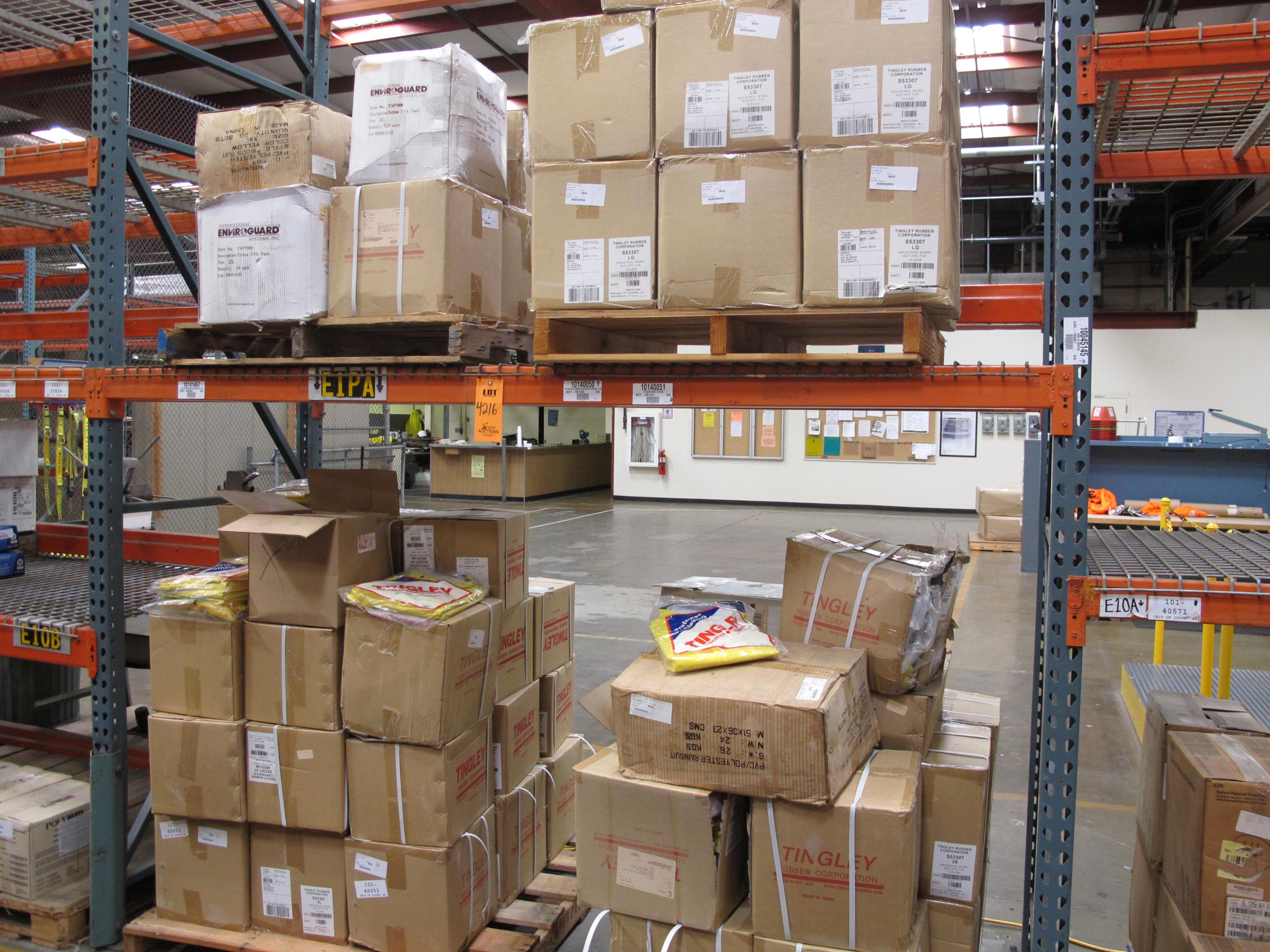 LOT TO INCLUDE: LARGE QUANTITY OF RAIN COATS, RAIN PANTS, AND COVERALLS.. LOADING & HANDLING FEE $15-4216